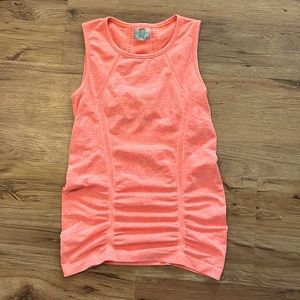 NWOT size small Athleta muscle tank in a orange coral color.
